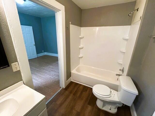 2238 N Rogers Ave, Springfield, MO 65803 - full bathroom featuring wood finished floors, toilet, baseboards, and vanity