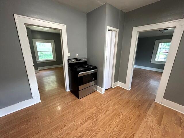 2238 N Rogers Ave, Springfield, MO 65803 - kitchen featuring electric range, healthy amount of natural light, and light wood-style flooring