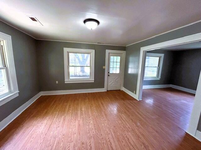 2238 N Rogers Ave, Springfield, MO 65803 - entryway featuring wood finished floors, baseboards, and crown molding