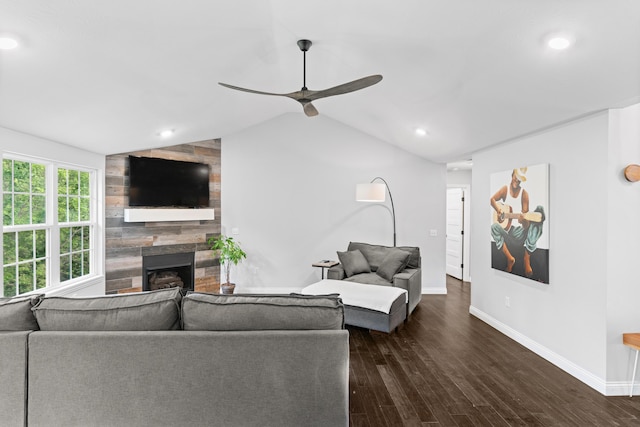 5404 S Clifton Ave, Springfield, MO 65810 - living area featuring a tile fireplace, a ceiling fan, baseboards, dark wood finished floors, and lofted ceiling