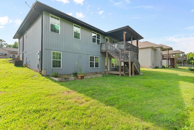 5404 S Clifton Ave, Springfield, MO 65810 - back of property with stairs, central AC, a lawn, and a wooden deck