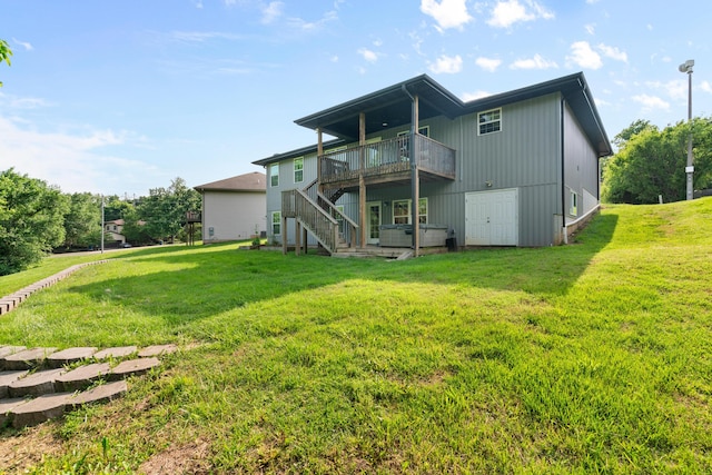 5404 S Clifton Ave, Springfield, MO 65810 - back of property featuring stairs, a lawn, and a deck