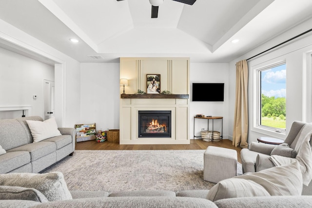 4531 E Hidden Oak St, Springfield, MO 65802 - living area with a ceiling fan, a glass covered fireplace, vaulted ceiling, wood finished floors, and recessed lighting