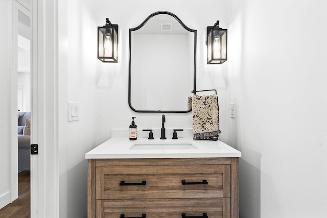 4531 E Hidden Oak St, Springfield, MO 65802 - bathroom featuring vanity and wood finished floors