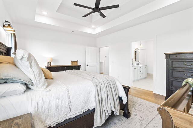 4531 E Hidden Oak St, Springfield, MO 65802 - bedroom with recessed lighting, light wood finished floors, a tray ceiling, ensuite bath, and ceiling fan