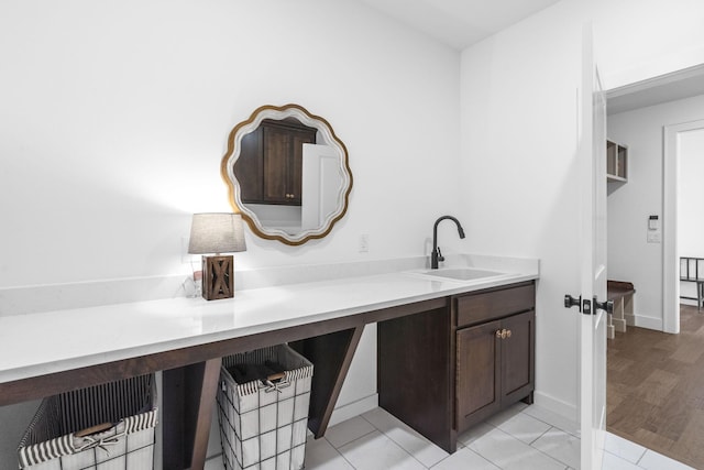4531 E Hidden Oak St, Springfield, MO 65802 - bathroom featuring a sink, tile patterned flooring, and baseboards