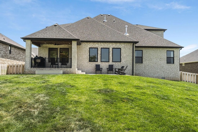 4531 E Hidden Oak St, Springfield, MO 65802 - rear view of house featuring a shingled roof, a patio, and brick siding