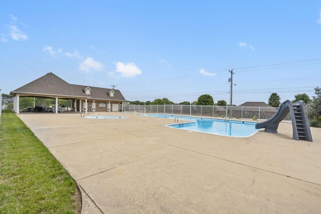4531 E Hidden Oak St, Springfield, MO 65802 - community pool featuring fence, a water slide, and a patio area