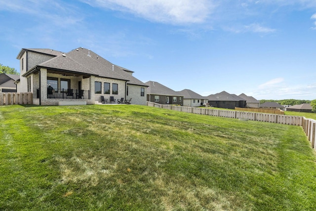 4531 E Hidden Oak St, Springfield, MO 65802 - rear view of property with a patio area, brick siding, a shingled roof, ceiling fan, and a residential view
