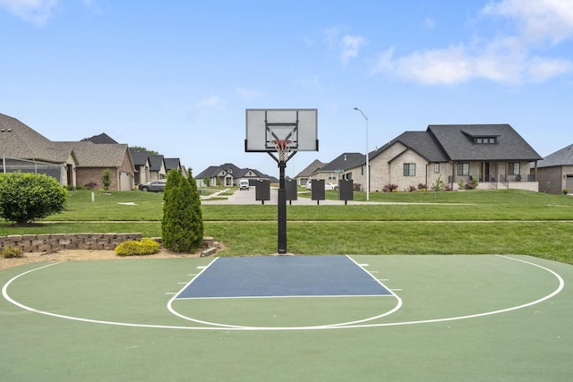 4531 E Hidden Oak St, Springfield, MO 65802 - view of sport court with basketball court, a residential view, and a yard