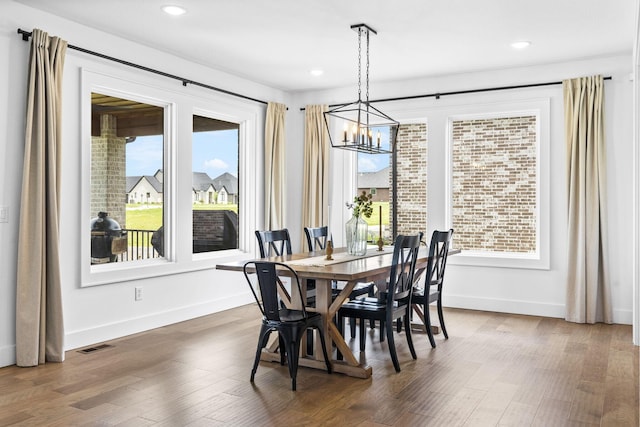 4531 E Hidden Oak St, Springfield, MO 65802 - dining space featuring a chandelier, baseboards, wood finished floors, and recessed lighting