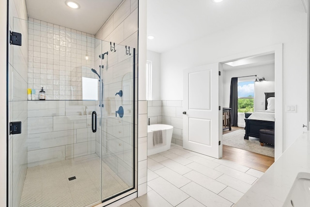 4531 E Hidden Oak St, Springfield, MO 65802 - full bath with a soaking tub, a shower stall, recessed lighting, tile patterned floors, and ensuite bath