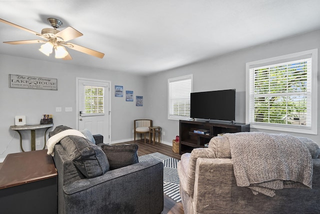 17 Montague Ln, Kimberling City, MO 65686 - living room with dark wood-type flooring, healthy amount of natural light, and a ceiling fan