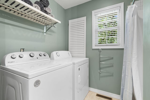 17 Montague Ln, Kimberling City, MO 65686 - washroom featuring washer and clothes dryer, baseboards, and light tile patterned floors