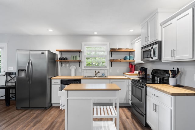 17 Montague Ln, Kimberling City, MO 65686 - kitchen featuring appliances with stainless steel finishes, butcher block counters, a sink, open shelves, and recessed lighting