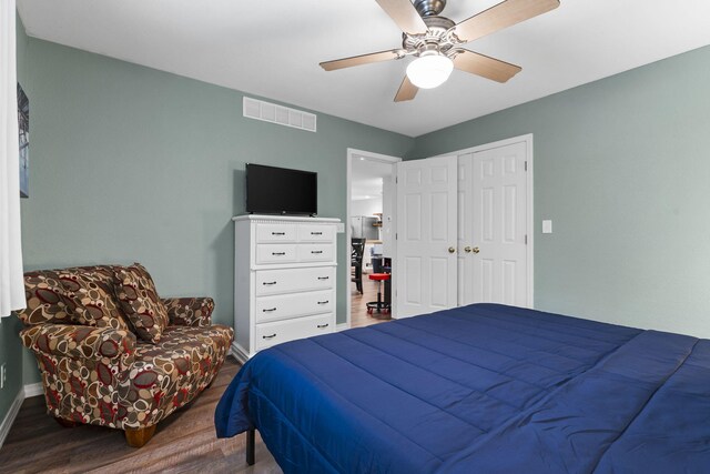 17 Montague Ln, Kimberling City, MO 65686 - bedroom featuring wood finished floors, baseboards, a ceiling fan, and a closet