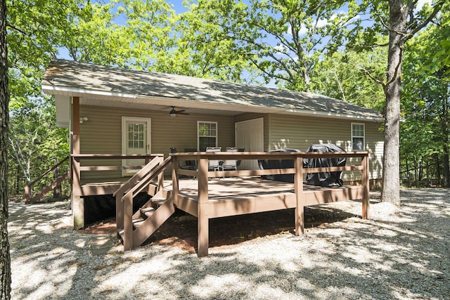 17 Montague Ln, Kimberling City, MO 65686 - rear view of property featuring a wooden deck, a ceiling fan, and roof with shingles