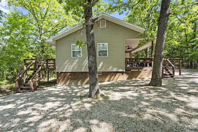 17 Montague Ln, Kimberling City, MO 65686 - rear view of property with stairway, a deck, and crawl space