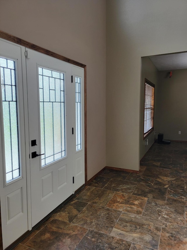 1995 Corder Pass Rd, Mansfield, MO 65704 - foyer entrance featuring stone tile flooring, baseboards, and a towering ceiling