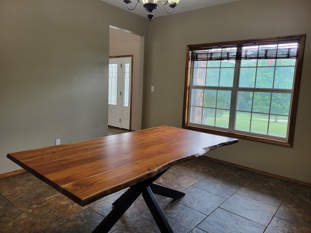 1995 Corder Pass Rd, Mansfield, MO 65704 - dining room featuring stone tile flooring, baseboards, and a chandelier