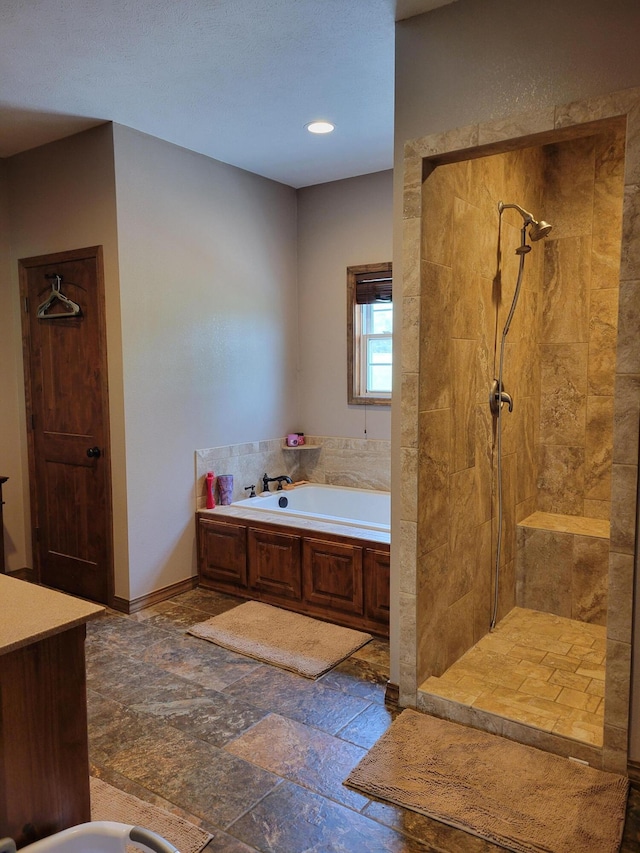1995 Corder Pass Rd, Mansfield, MO 65704 - full bathroom with a tile shower, a garden tub, and stone finish flooring