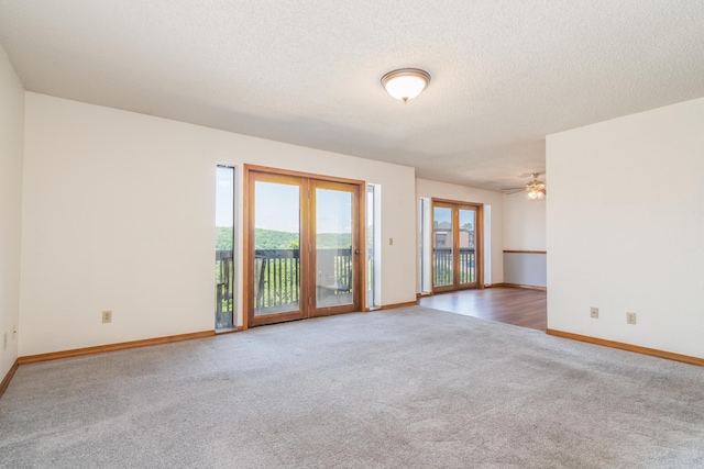 150 Sunken Forest Dr Unit 190, Forsyth, MO 65653 - empty room featuring plenty of natural light, carpet, baseboards, and a textured ceiling