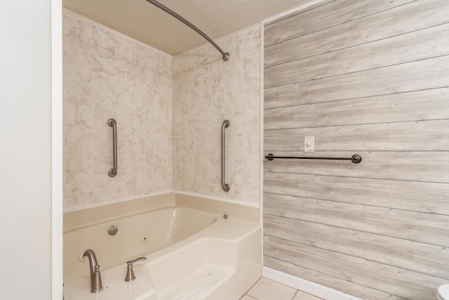 150 Sunken Forest Dr Unit 190, Forsyth, MO 65653 - full bath featuring a textured ceiling, tile patterned floors, and a combined bath / shower with jetted tub