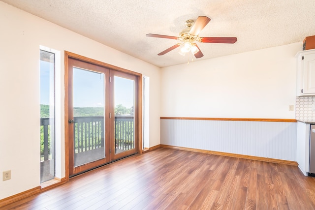 150 Sunken Forest Dr Unit 190, Forsyth, MO 65653 - unfurnished room with wood finished floors, a textured ceiling, ceiling fan, and baseboards
