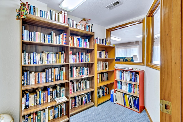 150 Sunken Forest Dr Unit 190, Forsyth, MO 65653 - sitting room featuring carpet flooring and wall of books