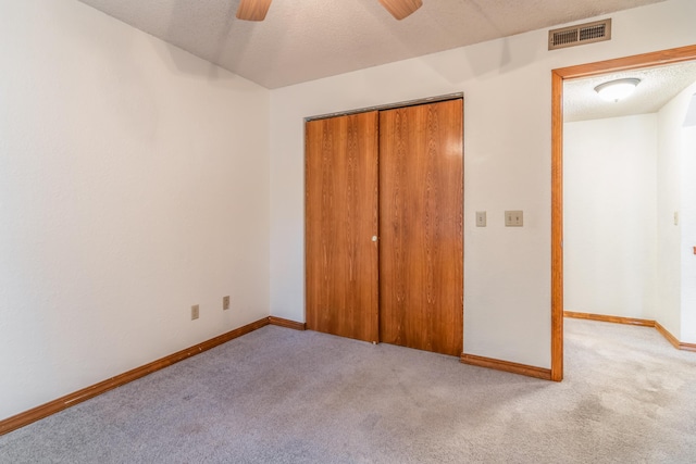 150 Sunken Forest Dr Unit 190, Forsyth, MO 65653 - unfurnished bedroom featuring light colored carpet, a closet, baseboards, a ceiling fan, and a textured ceiling