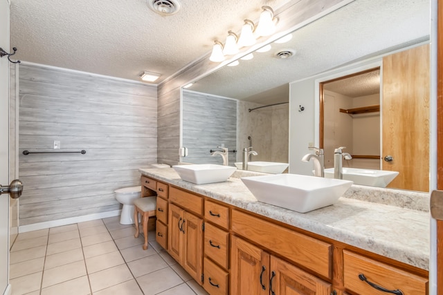 150 Sunken Forest Dr Unit 190, Forsyth, MO 65653 - full bath featuring a textured ceiling, toilet, double vanity, and tile patterned floors