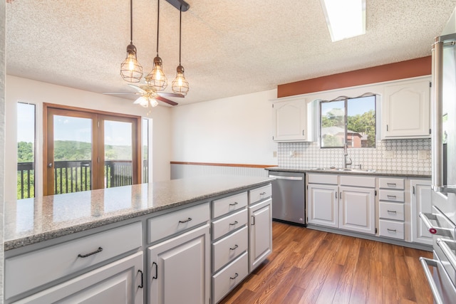 150 Sunken Forest Dr Unit 190, Forsyth, MO 65653 - kitchen with appliances with stainless steel finishes, a sink, a ceiling fan, backsplash, and dark wood-style floors