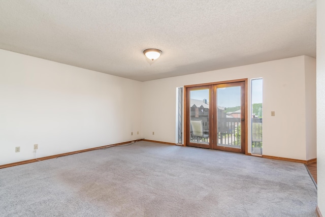 150 Sunken Forest Dr Unit 190, Forsyth, MO 65653 - empty room with light colored carpet, baseboards, and a textured ceiling