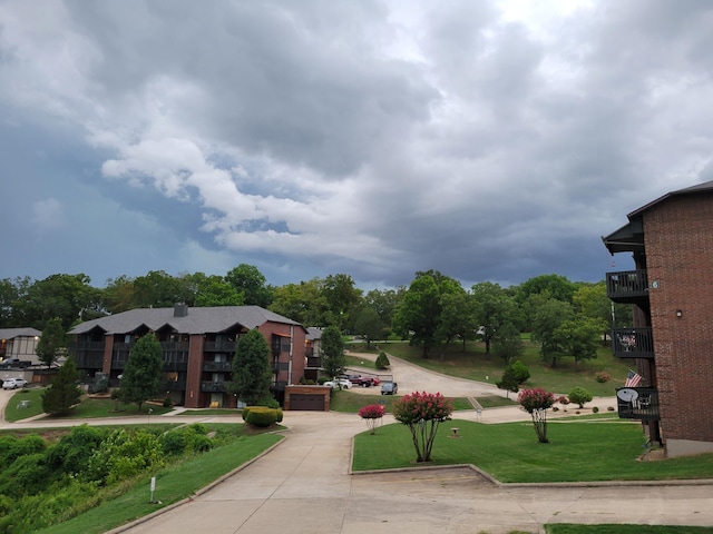 150 Sunken Forest Dr Unit 190, Forsyth, MO 65653 - surrounding community featuring concrete driveway, a lawn, and a garage
