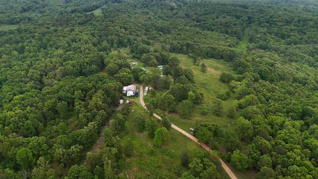 view of property location featuring a heavily wooded area