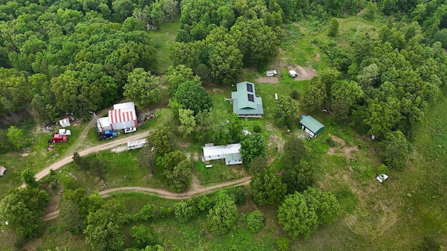 aerial overview of property's location with a heavily wooded area