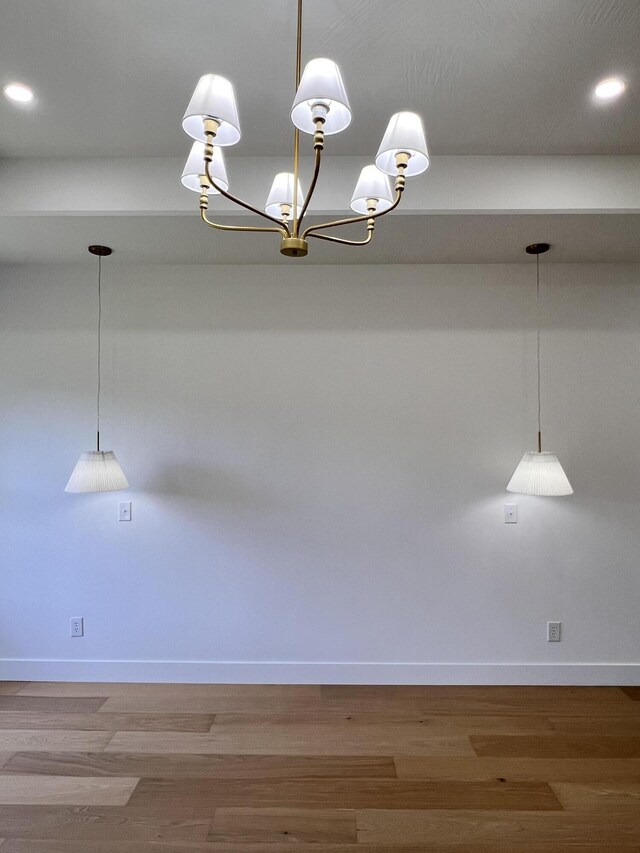 2077 N Sun Valley Dr, Springfield, MO 65802 - empty room with baseboards, wood finished floors, recessed lighting, and a chandelier