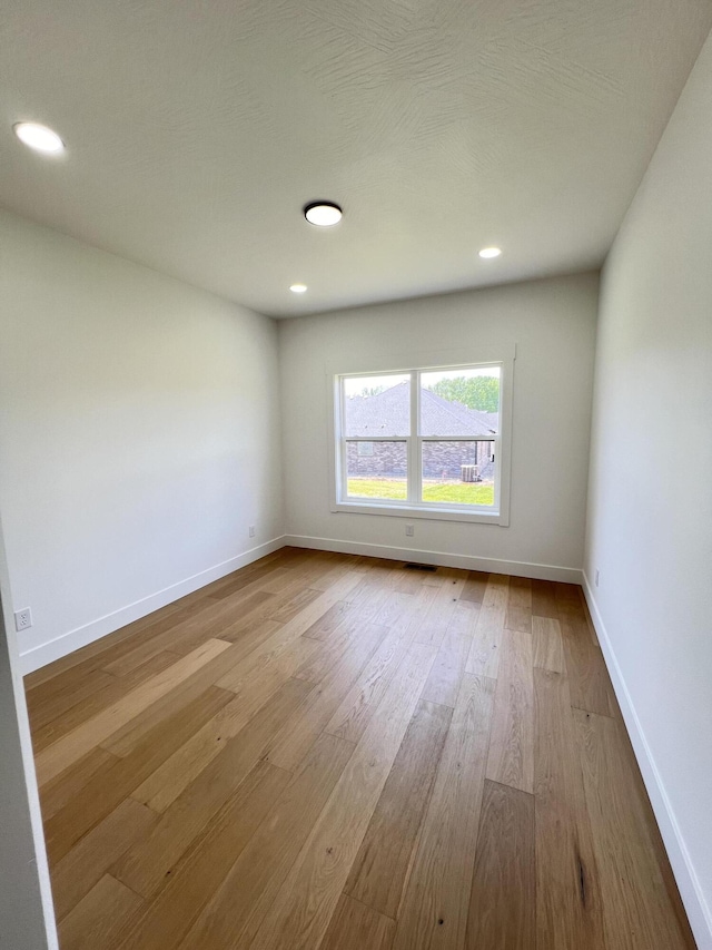 2077 N Sun Valley Dr, Springfield, MO 65802 - empty room featuring baseboards, wood finished floors, and recessed lighting