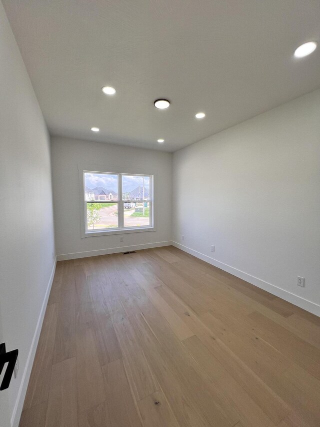 2077 N Sun Valley Dr, Springfield, MO 65802 - empty room with baseboards, wood finished floors, and recessed lighting
