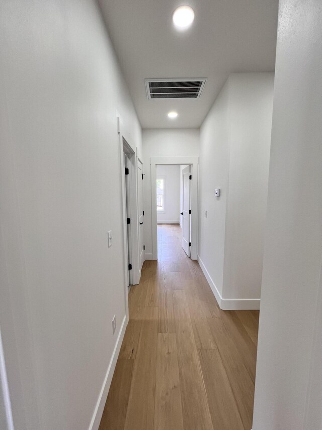 2077 N Sun Valley Dr, Springfield, MO 65802 - corridor with light wood-type flooring, baseboards, and recessed lighting