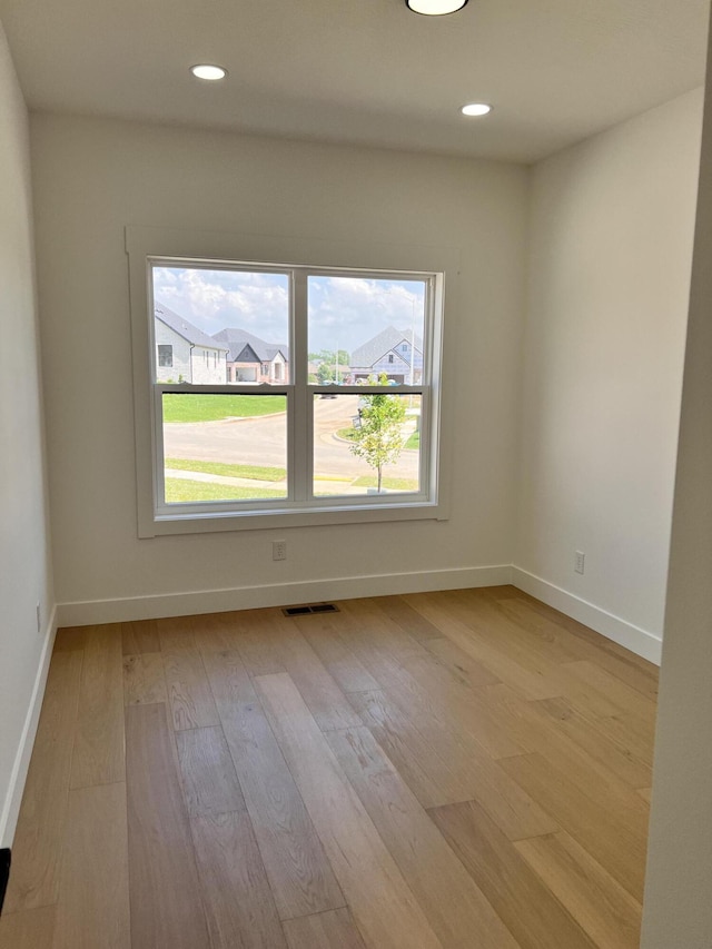2077 N Sun Valley Dr, Springfield, MO 65802 - empty room with light wood finished floors, baseboards, and recessed lighting