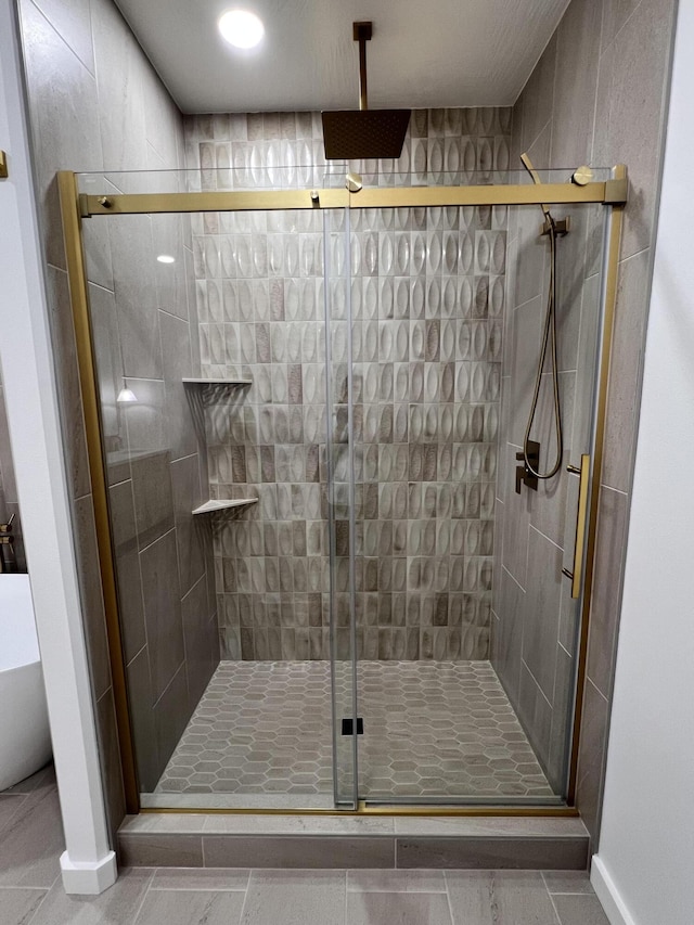 2077 N Sun Valley Dr, Springfield, MO 65802 - full bath with a shower stall, tile patterned floors, and baseboards