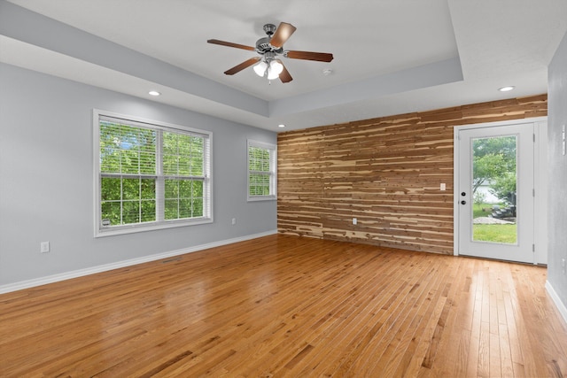 805 S Benson Pl, Nixa, MO 65714 - unfurnished room featuring light wood-type flooring, ceiling fan, recessed lighting, baseboards, and wooden walls