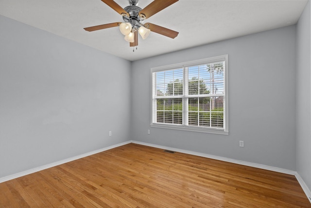 805 S Benson Pl, Nixa, MO 65714 - spare room featuring baseboards, light wood-type flooring, and a ceiling fan