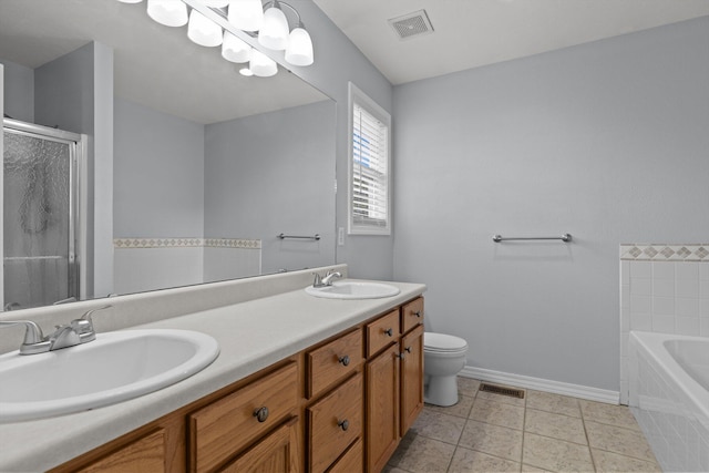 805 S Benson Pl, Nixa, MO 65714 - bathroom featuring baseboards, a shower stall, double vanity, a bath, and toilet