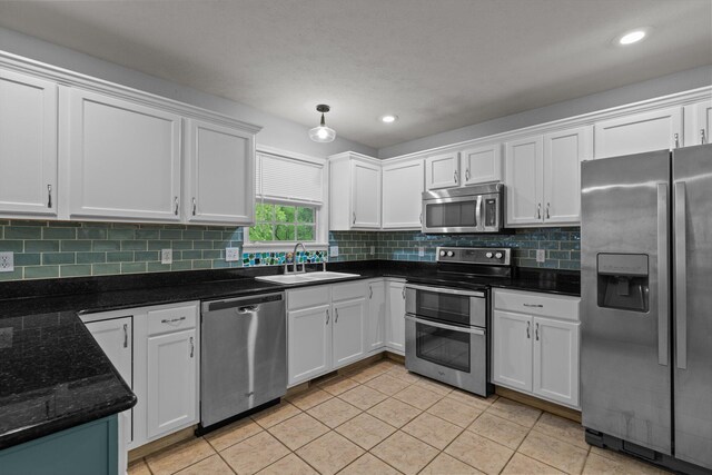 805 S Benson Pl, Nixa, MO 65714 - kitchen featuring stainless steel appliances, a sink, white cabinetry, and recessed lighting