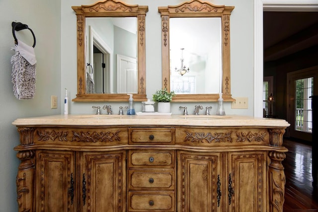 full bath featuring hardwood / wood-style flooring and double vanity