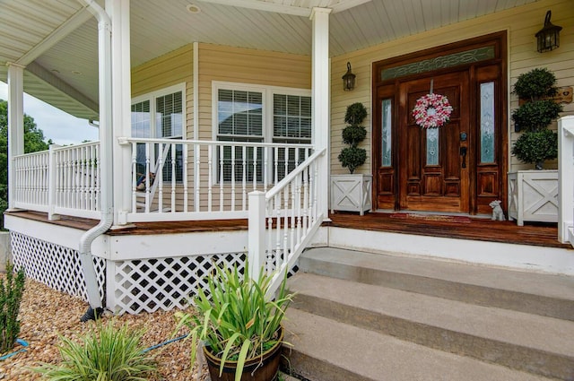 property entrance featuring covered porch