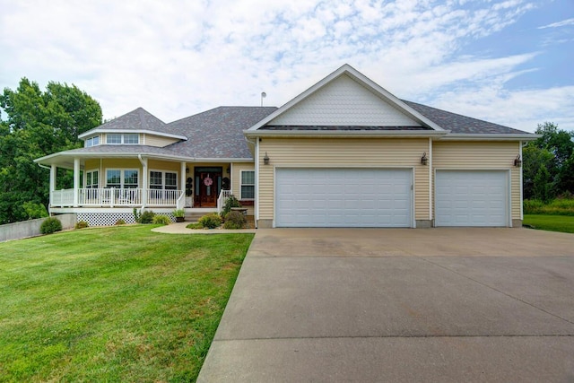 view of front of house with a garage, concrete driveway, a front yard, and covered porch