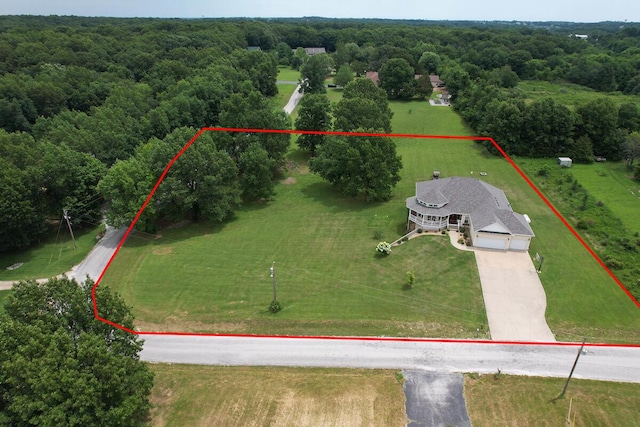 overview of rural landscape with property parcel outlined and a heavily wooded area